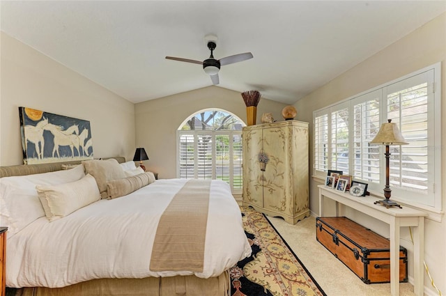 bedroom with multiple windows, lofted ceiling, light carpet, and ceiling fan