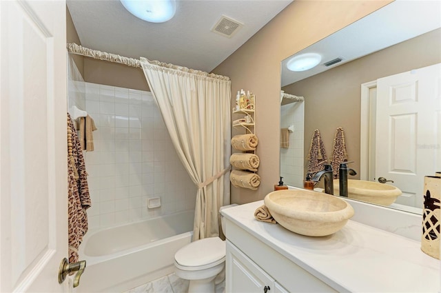 full bath with vanity, shower / bath combo with shower curtain, toilet, and visible vents