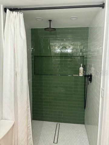 full bathroom featuring a stall shower