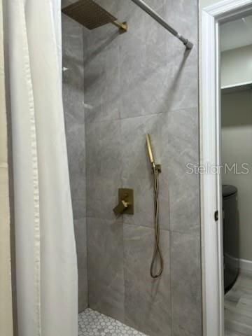 bathroom with a shower stall