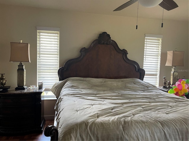 bedroom featuring wood finished floors and a ceiling fan