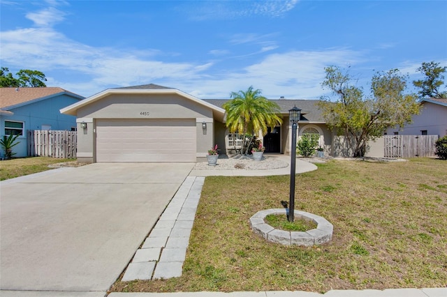 ranch-style home with a front lawn, fence, stucco siding, a garage, and driveway