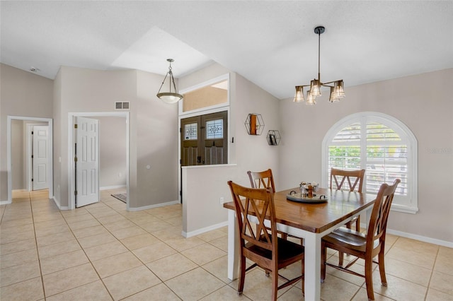 dining room with light tile patterned floors, baseboards, visible vents, an inviting chandelier, and vaulted ceiling