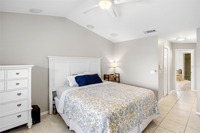 bedroom with baseboards, visible vents, lofted ceiling, light tile patterned flooring, and ceiling fan