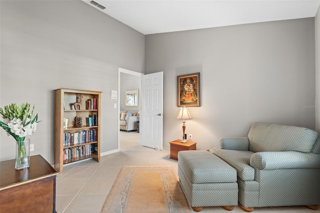 7300 Wax Myrtle Way, Sarasota, FL 34241 - sitting room featuring light tile patterned floors and baseboards