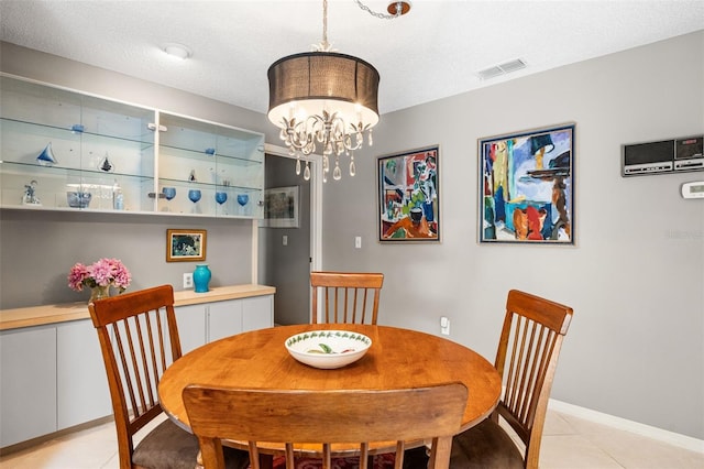 7300 Wax Myrtle Way, Sarasota, FL 34241 - dining space with a chandelier and light tile patterned flooring