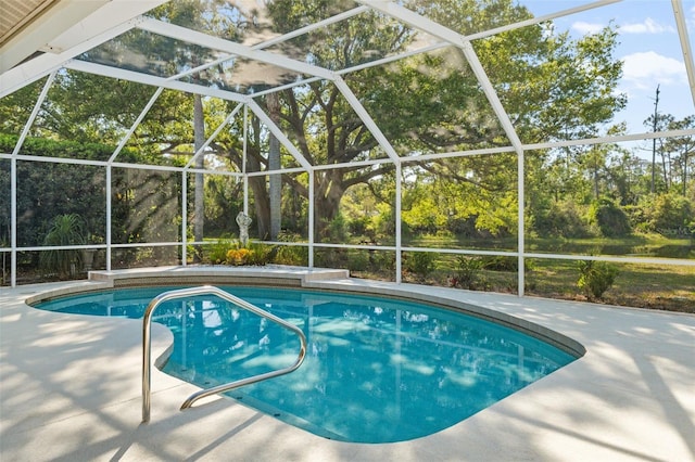 7300 Wax Myrtle Way, Sarasota, FL 34241 - swimming pool featuring a patio, a lanai, and view of wooded area