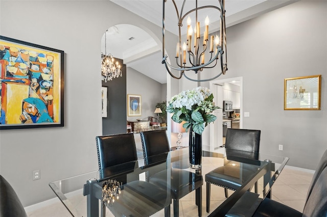 7300 Wax Myrtle Way, Sarasota, FL 34241 - dining room with a chandelier, high vaulted ceiling, arched walkways, and tile patterned floors