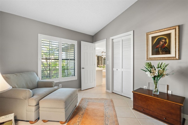 7300 Wax Myrtle Way, Sarasota, FL 34241 - sitting room with light tile patterned floors and vaulted ceiling