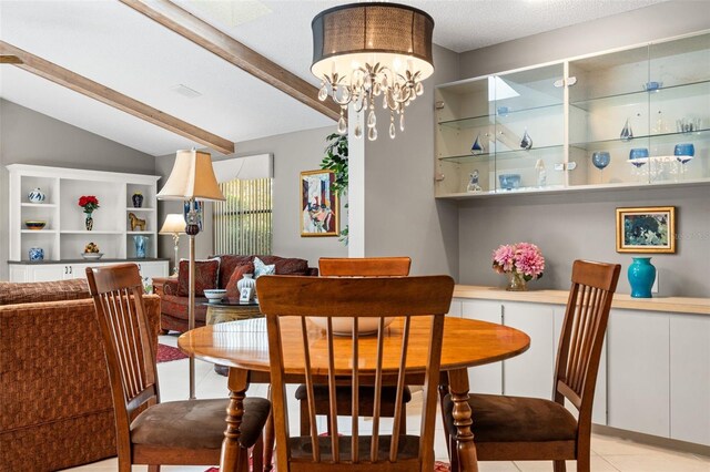 7300 Wax Myrtle Way, Sarasota, FL 34241 - dining space with light tile patterned floors and a chandelier