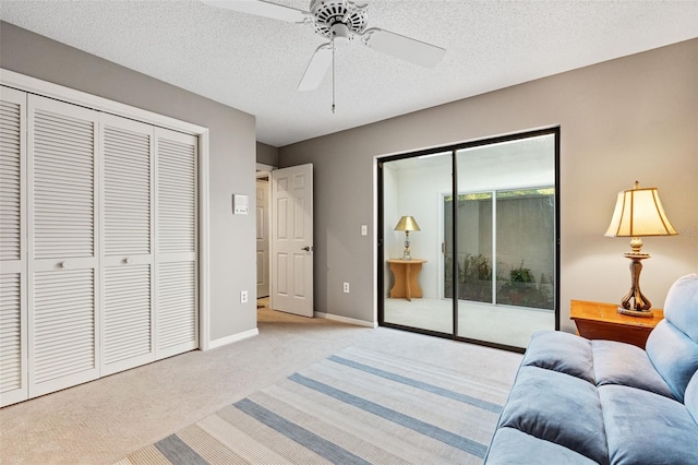 7300 Wax Myrtle Way, Sarasota, FL 34241 - bedroom featuring light carpet, a closet, a ceiling fan, and a textured ceiling