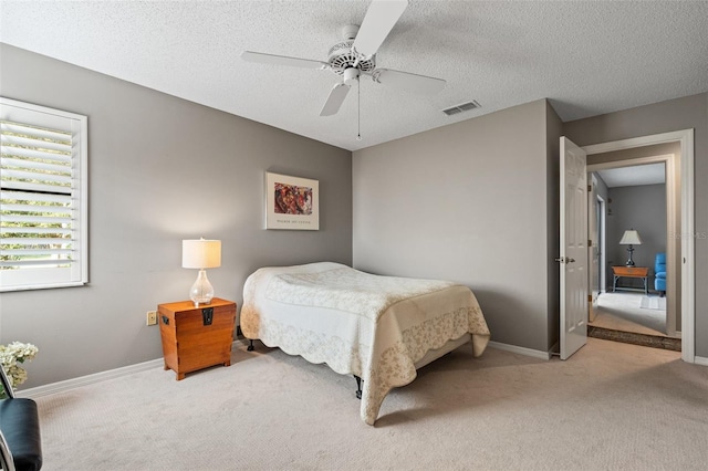 7300 Wax Myrtle Way, Sarasota, FL 34241 - carpeted bedroom featuring a textured ceiling and a ceiling fan