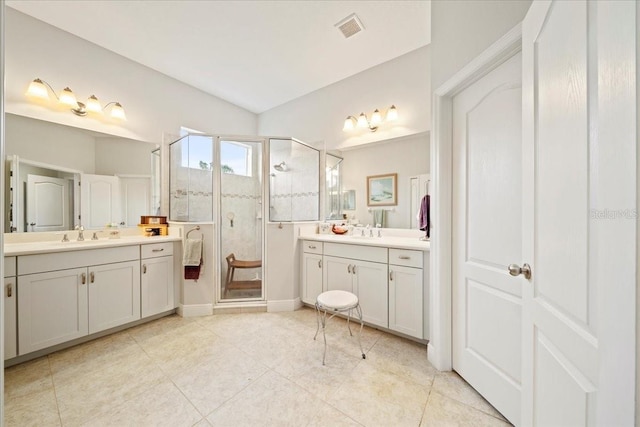 4691 Claremont Park Dr, Bradenton, FL 34211 - bathroom featuring a stall shower, two vanities, and tile patterned floors