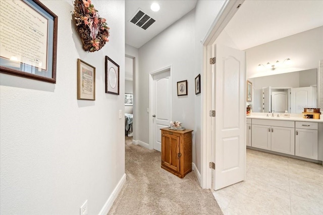 4691 Claremont Park Dr, Bradenton, FL 34211 - hallway with baseboards and a sink