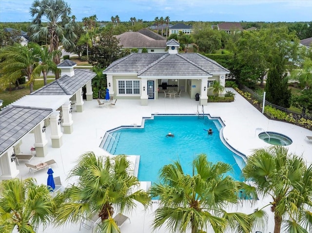 4691 Claremont Park Dr, Bradenton, FL 34211 - community pool featuring a community hot tub, a patio area, an outdoor structure, and a storage structure
