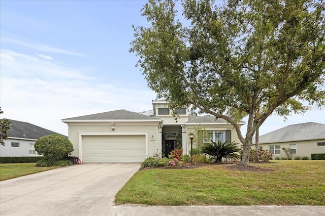 4691 Claremont Park Dr, Bradenton, FL 34211 - view of front of home with a garage, stucco siding, concrete driveway, and a front lawn