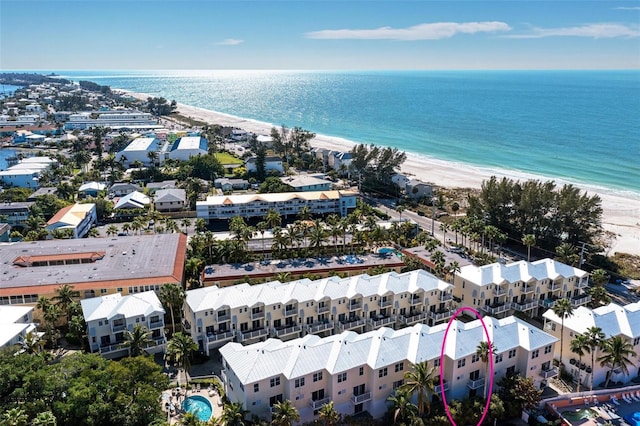 drone / aerial view featuring a view of the beach and a water view