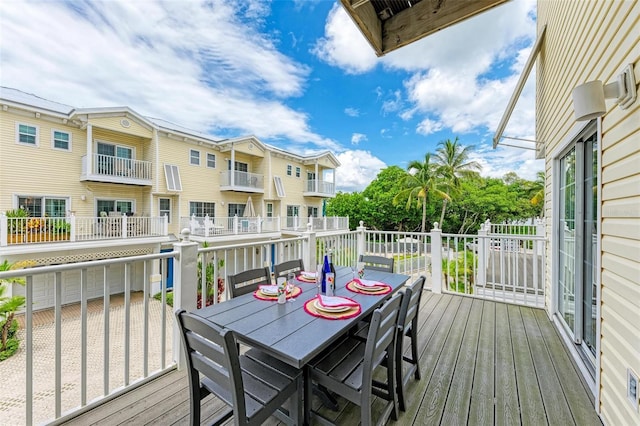 wooden deck featuring outdoor dining space