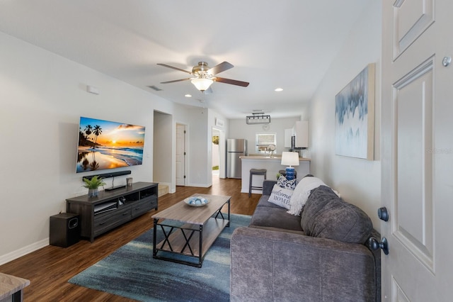 living room featuring recessed lighting, baseboards, wood finished floors, and a ceiling fan