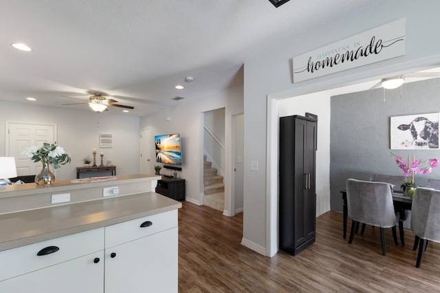 kitchen featuring light countertops, recessed lighting, white cabinetry, a ceiling fan, and dark wood-style flooring