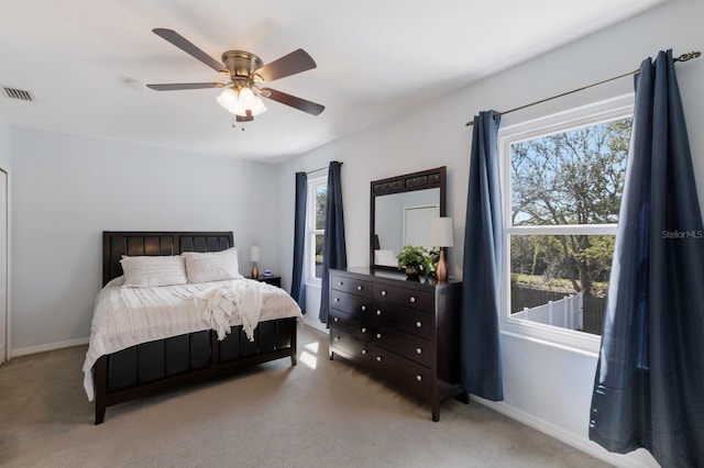 bedroom featuring a ceiling fan, carpet, visible vents, and baseboards