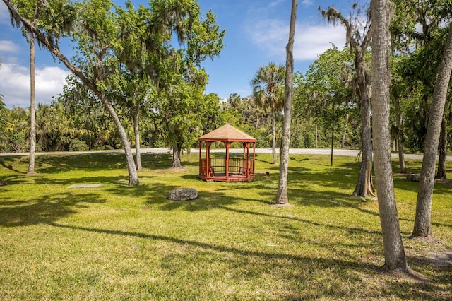 view of jungle gym with a gazebo and a lawn