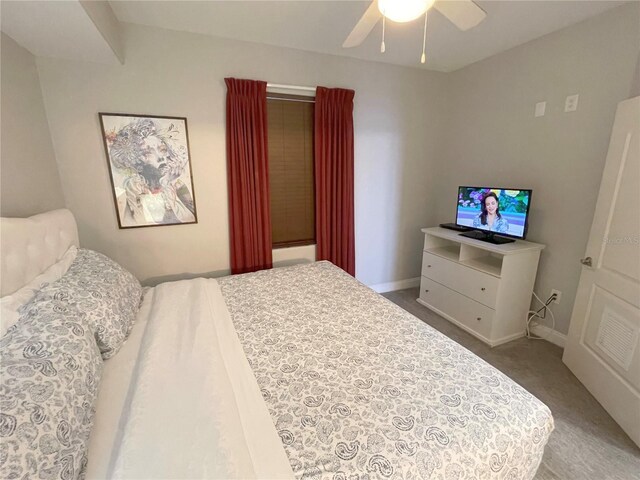 13415 Blue Heron Beach Dr Unit 1407, Orlando, FL 32821 - bedroom featuring ceiling fan, baseboards, and carpet floors