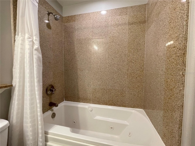 13415 Blue Heron Beach Dr Unit 1407, Orlando, FL 32821 - bathroom with toilet and a combined bath / shower with jetted tub