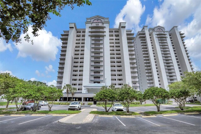 13415 Blue Heron Beach Dr Unit 1407, Orlando, FL 32821 - view of building exterior with uncovered parking