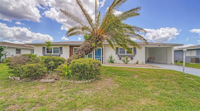 22201 Olean Blvd, Port Charlotte, FL 33952 - ranch-style house featuring central AC, concrete driveway, an attached carport, a front lawn, and stucco siding