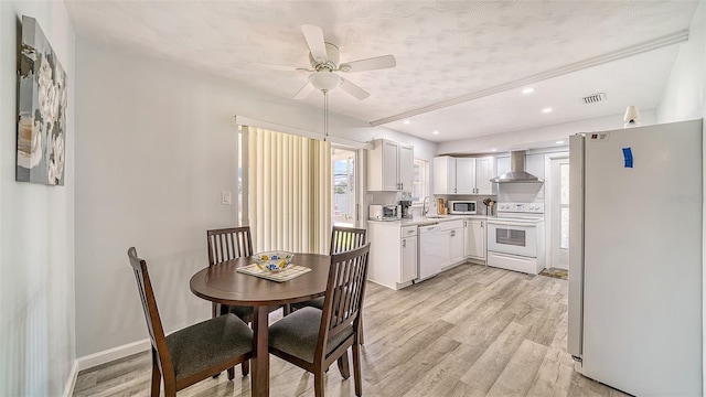 22201 Olean Blvd, Port Charlotte, FL 33952 - dining area featuring visible vents, ceiling fan, light wood-style flooring, and a wealth of natural light