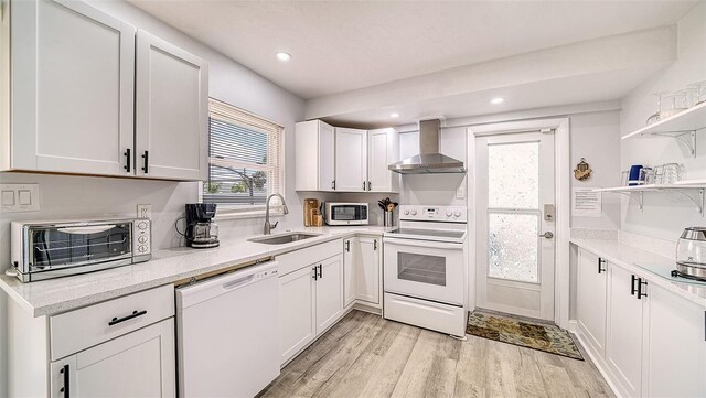 22201 Olean Blvd, Port Charlotte, FL 33952 - kitchen with white appliances, a sink, open shelves, light wood-style floors, and wall chimney range hood