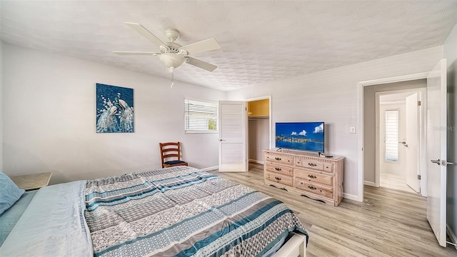 22201 Olean Blvd, Port Charlotte, FL 33952 - bedroom with a ceiling fan, light wood-style flooring, a closet, and baseboards
