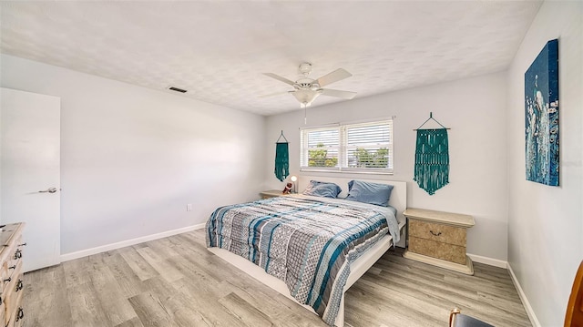 22201 Olean Blvd, Port Charlotte, FL 33952 - bedroom featuring baseboards, ceiling fan, visible vents, and wood finished floors