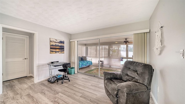 22201 Olean Blvd, Port Charlotte, FL 33952 - bedroom featuring a textured ceiling, baseboards, and wood finished floors