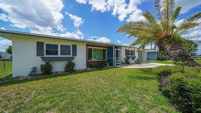 22201 Olean Blvd, Port Charlotte, FL 33952 - ranch-style house with stucco siding and a front lawn