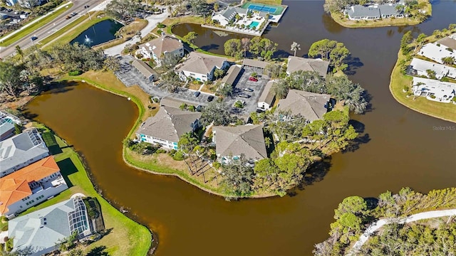 drone / aerial view featuring a water view and a residential view