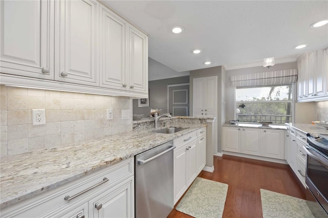 kitchen with dark wood-style flooring, white cabinets, appliances with stainless steel finishes, and a sink