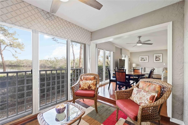 sunroom / solarium with ceiling fan