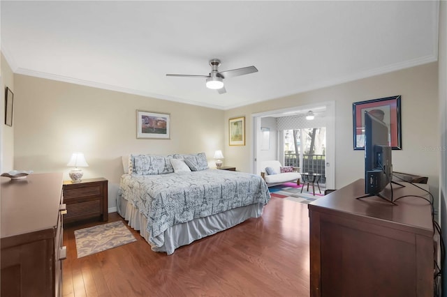 bedroom with crown molding, wood finished floors, and ceiling fan