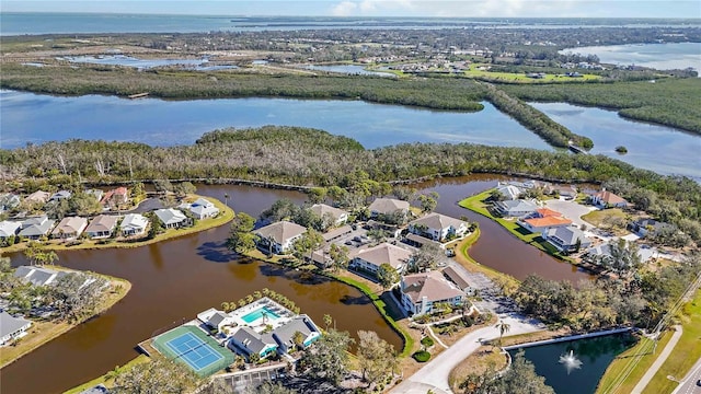 drone / aerial view with a water view and a residential view