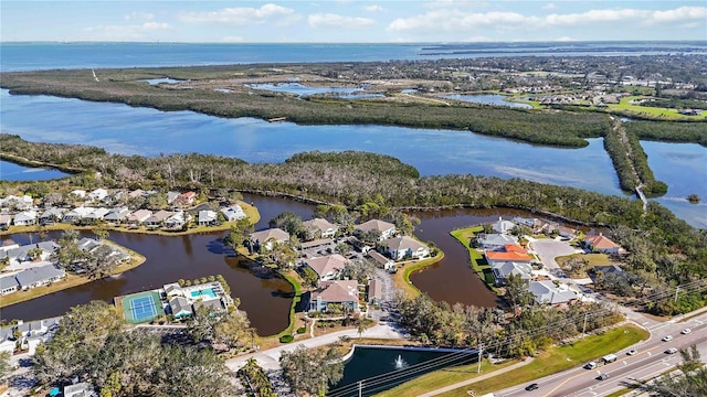 bird's eye view featuring a residential view and a water view