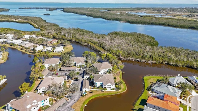 bird's eye view with a residential view and a water view