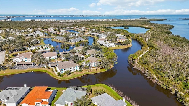 birds eye view of property featuring a residential view and a water view