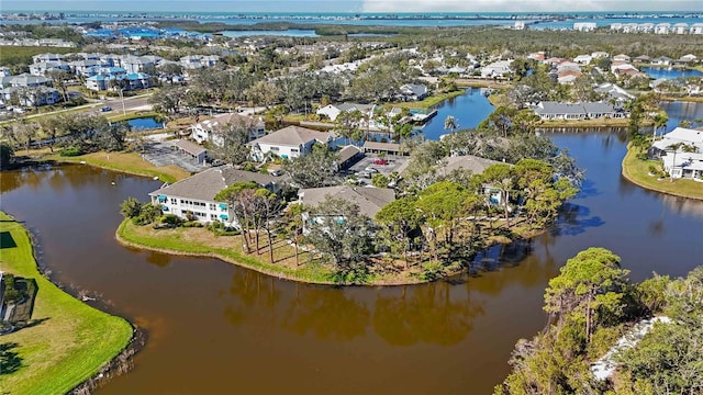 drone / aerial view with a residential view and a water view