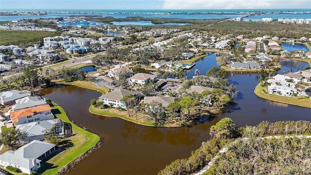 birds eye view of property with a residential view and a water view