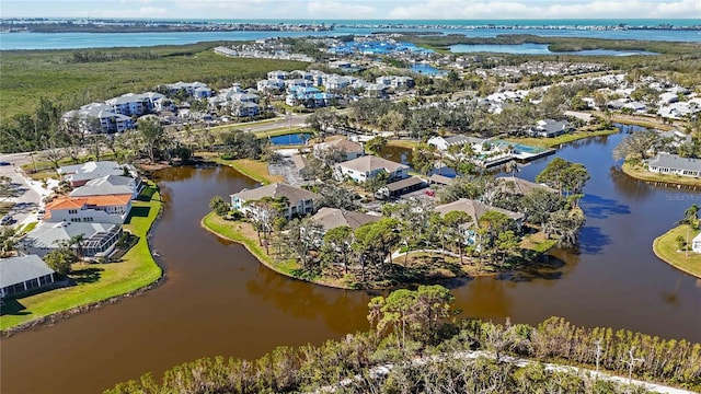 birds eye view of property featuring a residential view and a water view