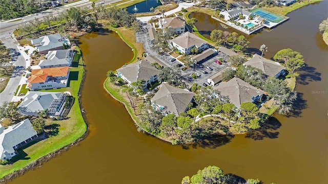 birds eye view of property with a residential view and a water view