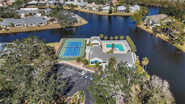 drone / aerial view featuring a residential view and a water view