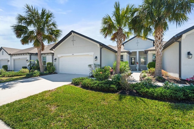 5998 Amberly Dr, Bradenton, FL 34208 - single story home with stucco siding, an attached garage, driveway, and a front lawn